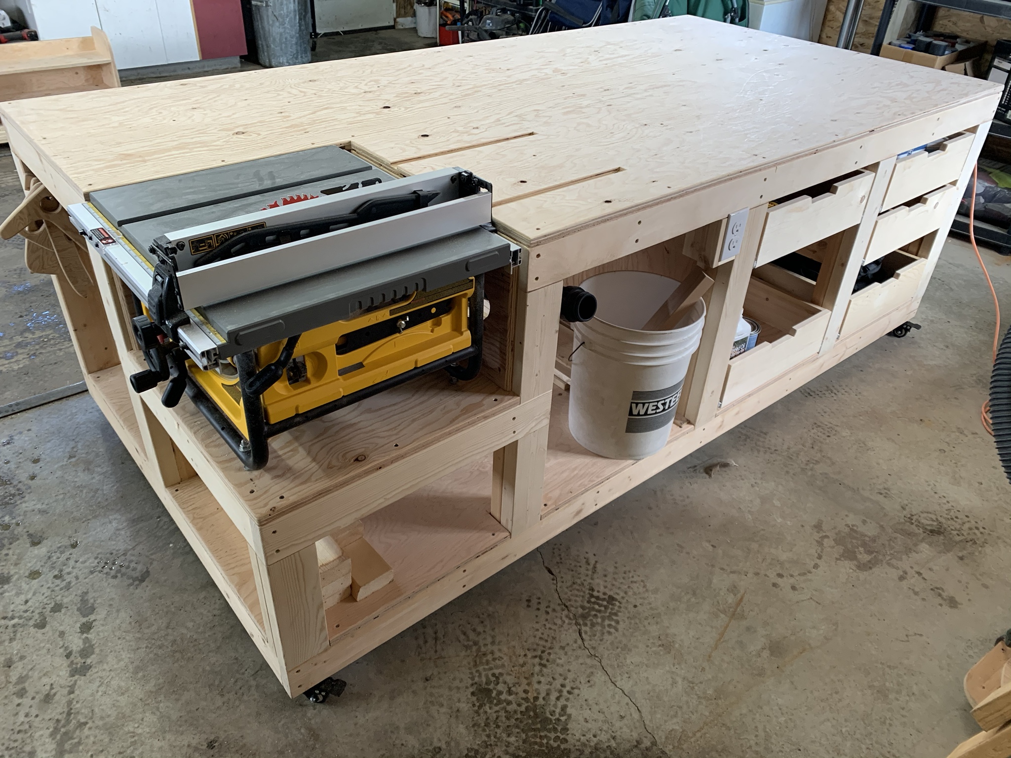 Sturdy plywood woodworking workbench with storage shelves